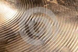 Surface of heavily used hihat bronze hand hammered cymbal. photo