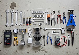 Surface, including wrenches, screwdrivers, socket set, pliers, and a