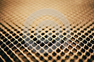 Surface of latticed metal fence. Stainless steel and aluminum light blur background. Macro texture