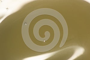 Surface of light condensed milk with bubbles