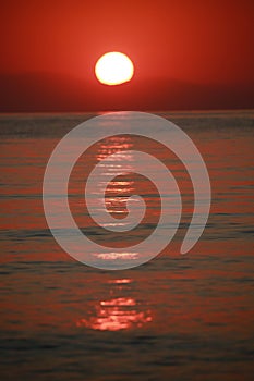 The surface of the Mediterranean Sea, painted red by the rising sun. Kemer, Turkey