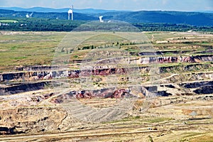 Surface mine with red minerals and brown coal, view from above