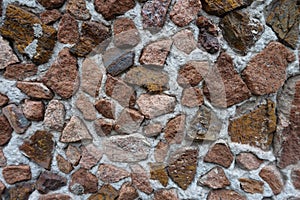 Surface of multicolored gravel pebble dash on the wall