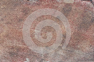 Surface of natural dark red stone as background