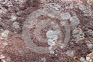 Surface of natural dark red stone as background