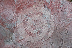 Surface of natural dark red stone as background