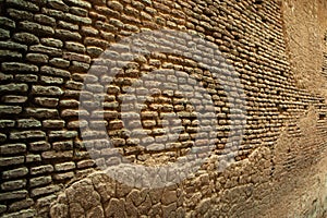 Surface of old ancient brick wall, India. Perspective view