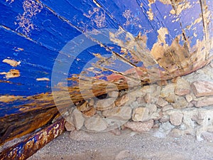 Surface of an old blue boat in shipyard dry dock