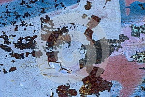 Surface of old rusty metal doors painted in various colors