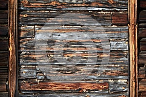 The surface of an old wooden wall with a frame on the edges. Natural vintage wood background. Horizontal orientation