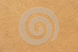 The surface of the old worn yellow dermatin