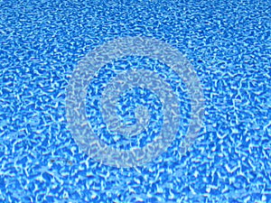 Surface of pool water with blue lining