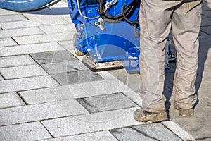Surface preparation job on granite blocks paving