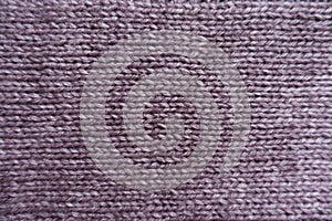 Surface of puce basic knitted fabric photo