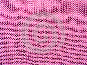 Surface of puce basic knitted fabric in pink photo