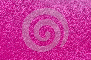 The surface of the red old worn dermatin