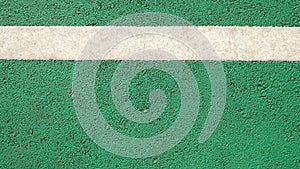 Surface rough of asphalt, Green road with white line, Bicycle lane, Texture Background, Top view.