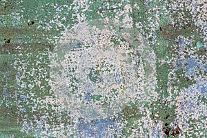 Surface of rusty iron with remnants of old multicolored paint texture background. Rust, corrosion on metal and remnants of blue, g