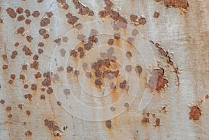 Surface of rusty iron with remnants of old paint, grey texture, background