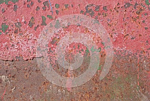 Surface of rusty iron with remnants of old paint, red texture, background
