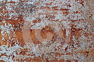 Surface of rusty iron with remnants of old white paint, chipped paint, texture background