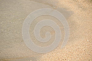 The surface of the sea on the sand, waves on the beach a