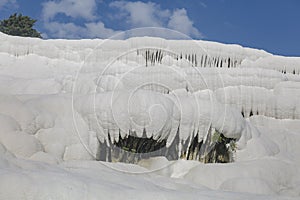 surface of the shimmering, snow-white limestone, shaped over millennia by calcite-rich springs photo