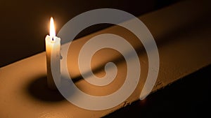 The surface is smooth reflecting the warm glow from the flame