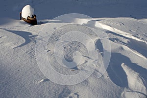 Snow fields covered with intricate patterns from the wind, a copy space, close-up.