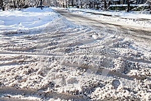 surface of snow-covered slippery urban road