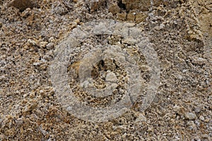 Surface structure of river sand. Large river sand at a construction site