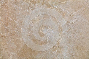 The surface, texture and background of beige marble with small whitish cracks