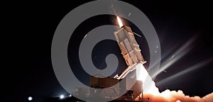 A surface to air missile (SAM), or surface to surface missile (SSM )launch at nighttime.