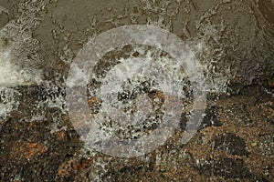 Surface turbulence of water on stone substrate