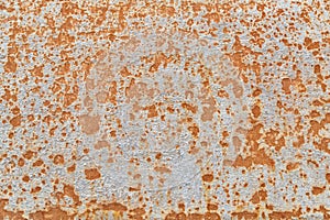 Surface of the underwater part of the hull of a ship with paint residues and rust stains