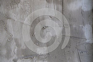 The surface of the wall is plastered with concrete.