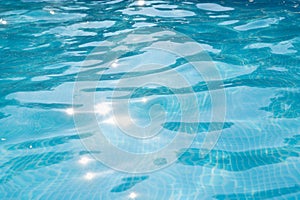 The surface of the water in the pool as an abstract background.
