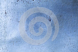 Surface of a worn-out metal baking tray, for gastronomical photography background, in cold, blue tones