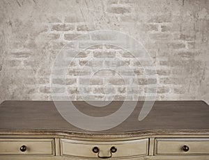 Surface of writing table with drawers over vintage background