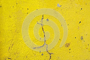 Surface of Yellow Cement wall with Crack wall texture background