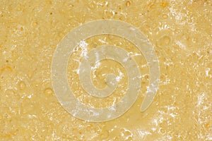 The surface of the yellow homemade omelet with a highlight