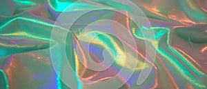 Surfaces of iridescent silk displaying shifting colors and a shimmering texture photo