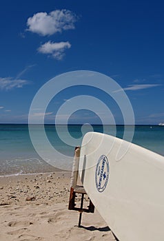 Surfboard on beach in hawaii
