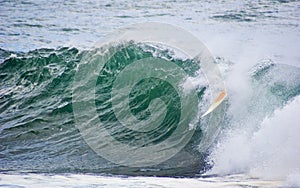 Surfboard dumped surf wave