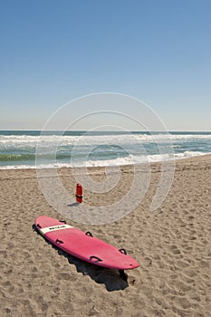 Surfboard and float on beach