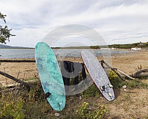 surfboards in Al Cartello beach near Orbetello, Tuscany, Italy photo