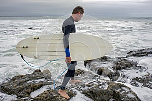 Surfer approaching the water