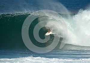 Surfer in a big barrel on the North Shore, Hawaii