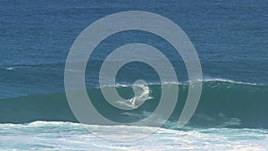 Surfer at the big wave surfing break Jaws in Peé©¶ahi at the north shore of the island of Maui, Hawaii