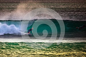 Surfer on Blue Ocean Wave in Bali